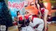 a group of asian women in santa claus outfits posing for a photo